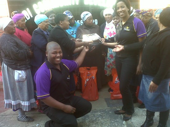 Hollywoodbets Estcourt presenting cake and food to the Sedi Community Development
