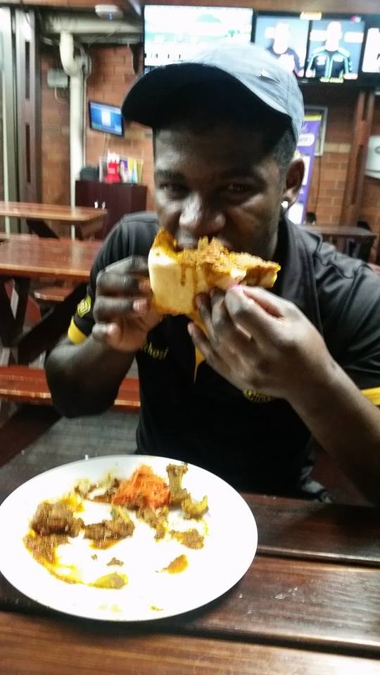 This is how you get stuck into a Hollywood Bunny Chow at Springfield Park, Durban
