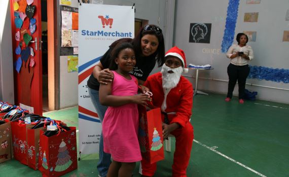 Girl receiving her gift from Santa Claus - Winning Form
