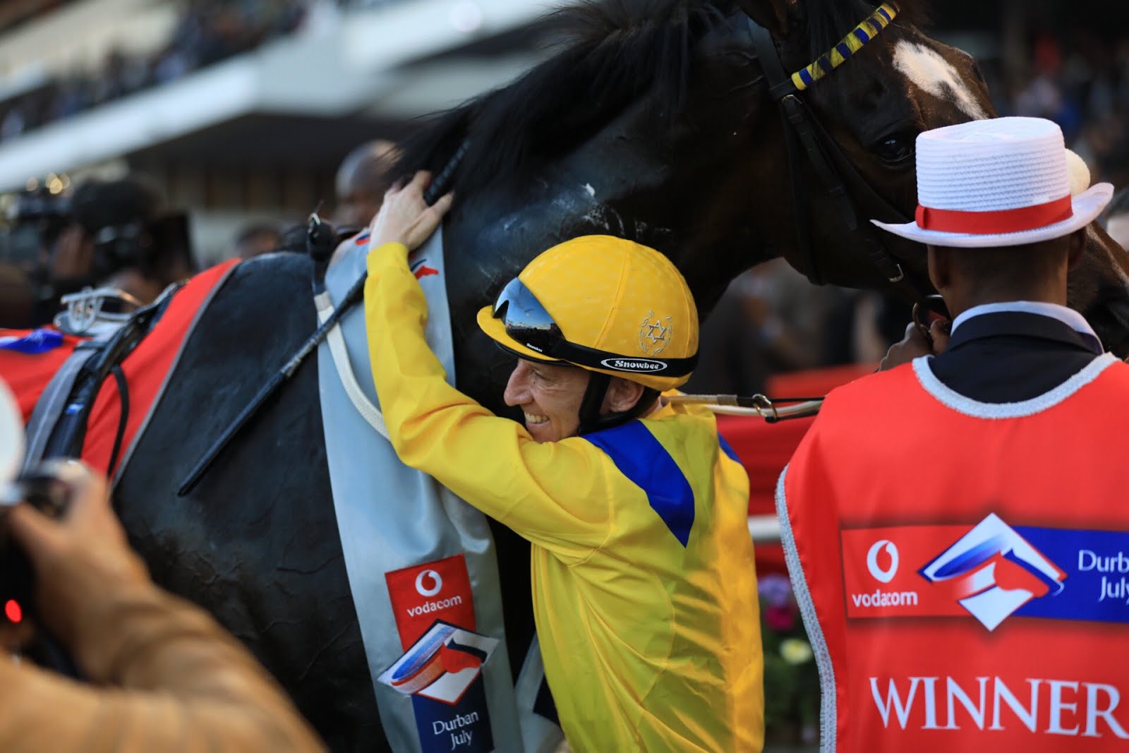 Anton Marcus hugging the horse Do It Again after winning the Vodacom Durban July 2018