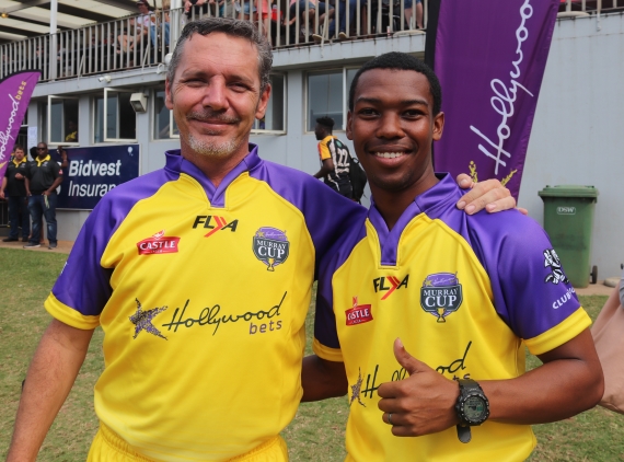 Rugby Referees pose in their purple and yellow Hollywoodbets Kit
