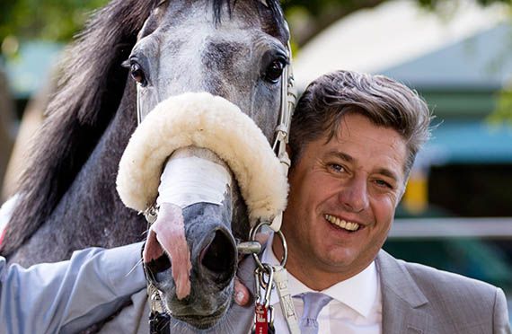Horse racing trainer Joey Ramsden with King of Pain