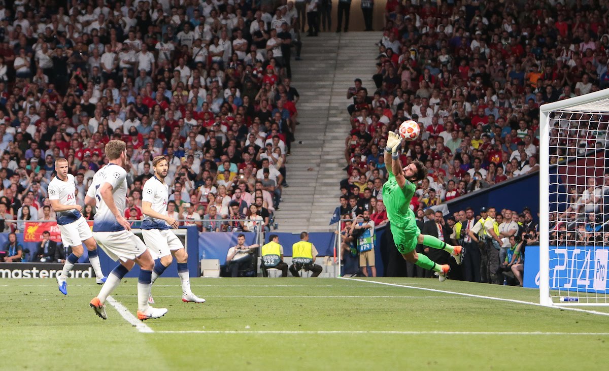 Alisson Becker of Liverpool saves from a Tottenham attack