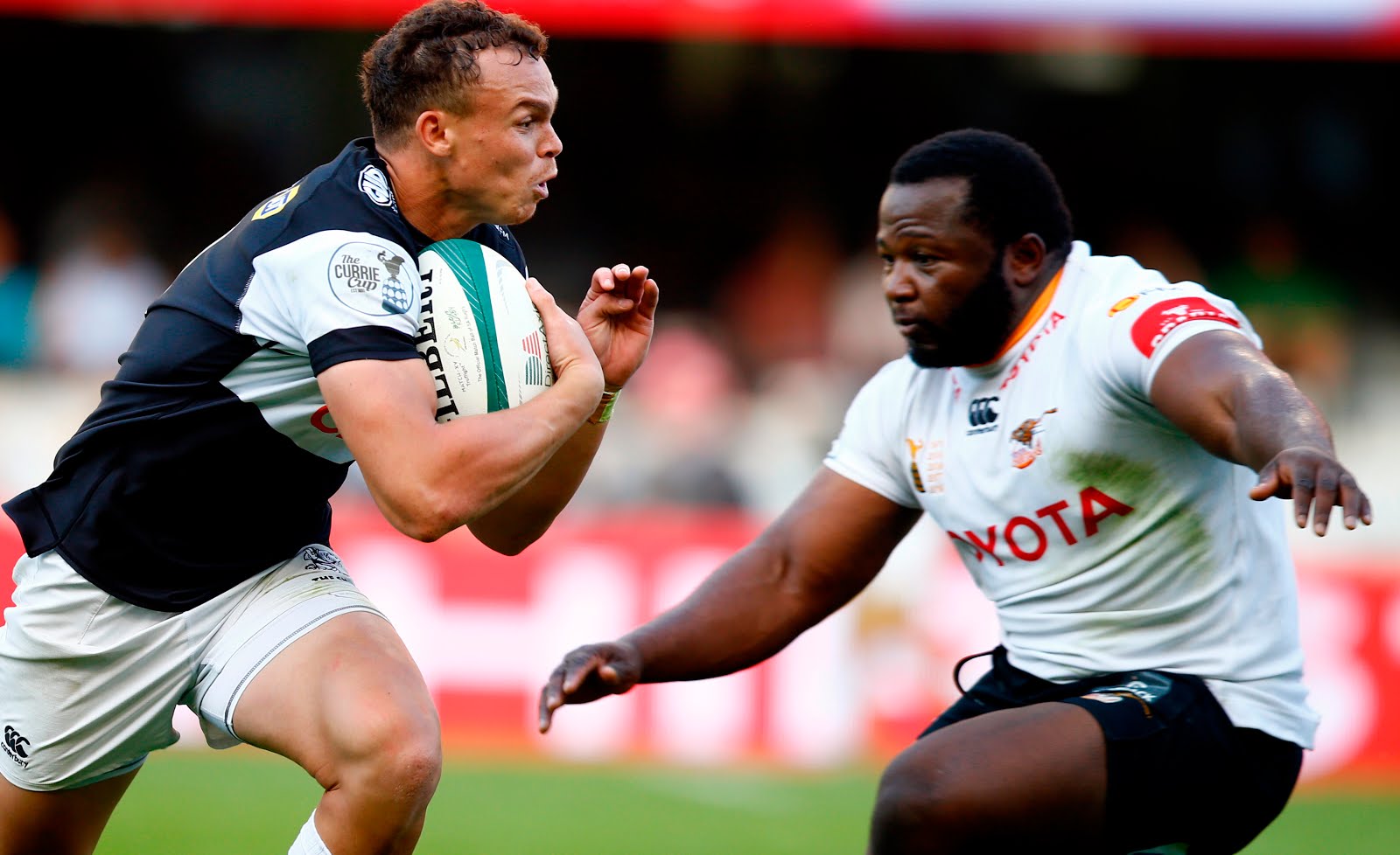 Ox Nche of the Free State Cheetahs looks to tackle Curwin Bosch of the Cell C Sharks during the Currie Cup match between the Cell C Sharks and the Free State Cheetahs at Jonsson Kings Park Stadium in Durban, South Africa 10th August 2019