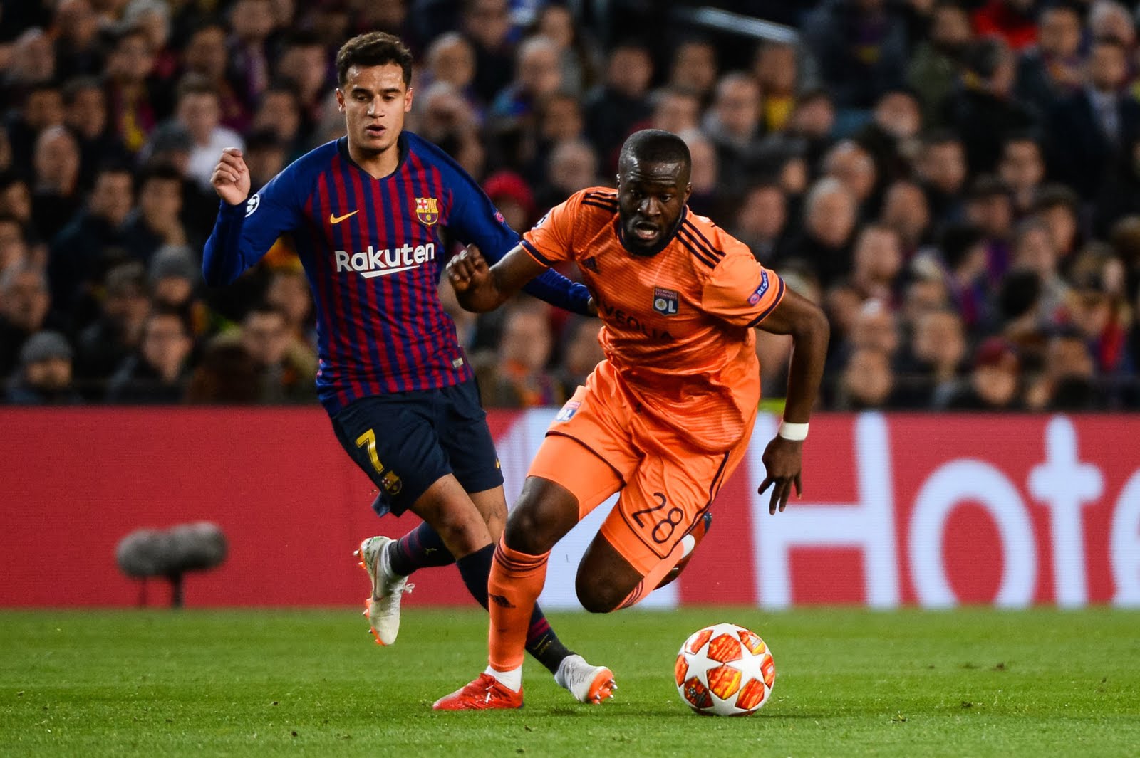 Philippe Coutinho of Barcelona and Tanguy Ndombele of Lyon during the UEFA Champions League Round of 16 Second Leg match between Barcelona and Lyon at Camp Nou on March 13, 2019 in Barcelona, Spain