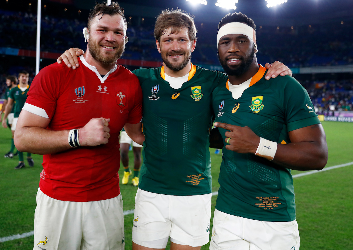 Duane Vermuelen, Frans Steyn and Siya Kolisi pose after South Africa beat Wales in the World Cup Semi-Final