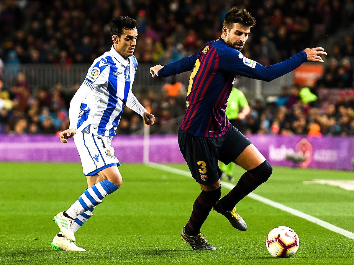 Gerard Pique of FC Barcelona and Juanmi Jimenez of Real Sociedad during the match between FC Barcelona vs Real Sociedad of La Liga, date 33, 2018-2019 season.