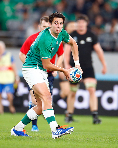Joey Carbery of Ireland passes the ball against New Zealand
