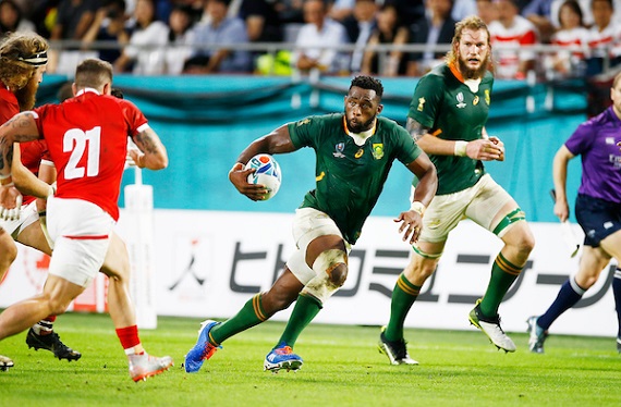 Siya Kolisi runs at Wales' defence at the World Cup with RG Snyman in the background