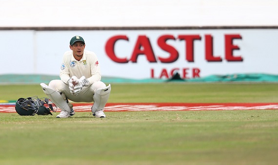 Quinton de Kock of South Africa crouches in wicket-keeping kit
