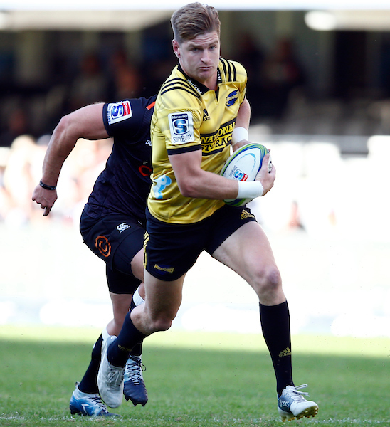 Jordie Barrett of the Hurricanes runs with ball in hand against the Cell C Sharks