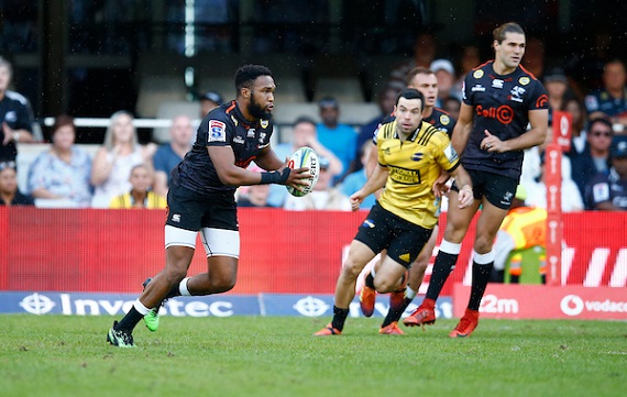 Lukhanyo Am of the Sharks runs with ball in hand against the Hurricanes