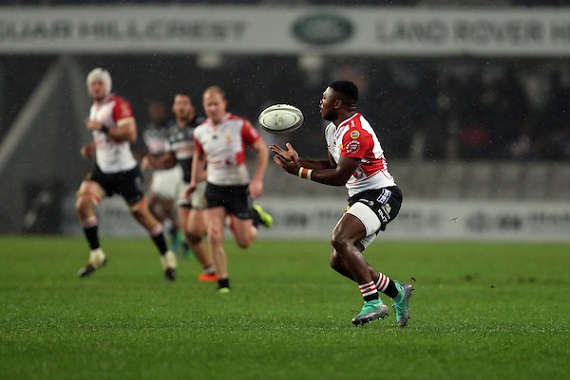 Wandisile Simelane of the Lions runs with the ball