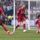 Salah celebrates scoring against Spurs - Premier League