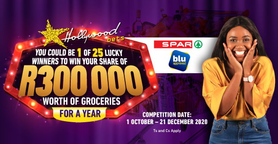 Woman poses excitedly - win a share of R300 000 worth of groceries with Hollywoodbets and SPAR