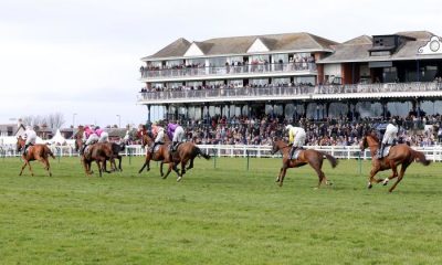 Runners and riders in action as they compete in the Remus Uomo Handicap Hurdle during the Coral Scottish Grand National Ladies Day at Ayr Racecourse, Ayr. Picture date: Friday April 1, 2022.