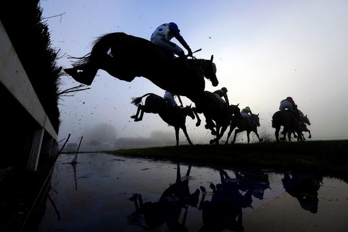 Runners and riders clear the water jump during the the Stalbridge Jingle Bells Staying Handicap Chase at Wincanton Racecourse. Picture date: Thursday December 1, 2022.