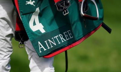 A jockey carries a saddle pad on day one of the Randox Grand National Festival at Aintree Racecourse, Liverpool. Picture date: Thursday April 13, 2023.
