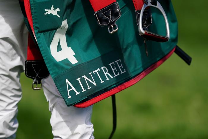 A jockey carries a saddle pad on day one of the Randox Grand National Festival at Aintree Racecourse, Liverpool. Picture date: Thursday April 13, 2023.