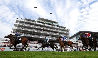 Totally Charming ridden by William Buick (left) on their way to winning the World Pool Handicap on Ladies Day during the Cazoo Derby Festival 2022 at Epsom Racecourse, Surrey. Picture date: Friday June 3, 2022.