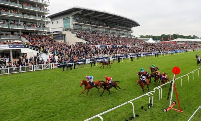 Examiner ridden by jockey Oisin Murphy (left) on his way to winning the Investec Mile on Ladies Day during the 2016 Investec Epsom Derby Festival at Epsom Racecourse, Epsom.