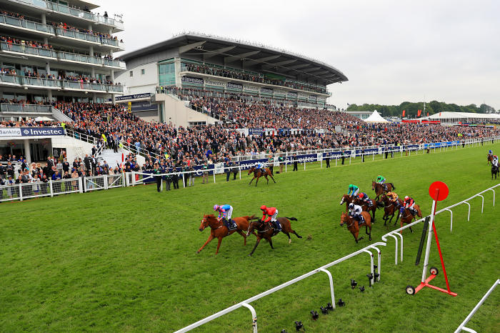 Examiner ridden by jockey Oisin Murphy (left) on his way to winning the Investec Mile on Ladies Day during the 2016 Investec Epsom Derby Festival at Epsom Racecourse, Epsom.