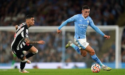 Newcastle United's Miguel Almiron (left) and Manchester City's Phil Foden