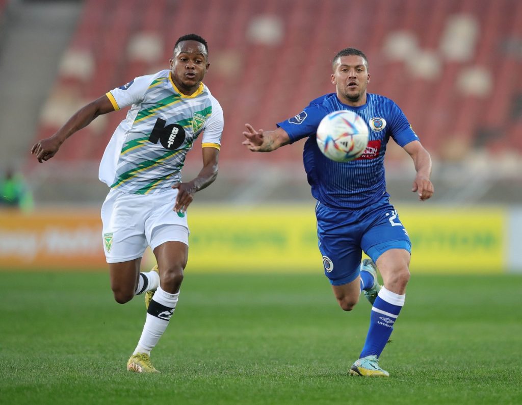 Grant Margeman of Supersport United challenged by Tebogo Tloplane of Golden Arrows