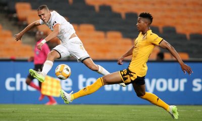 Sedwyn George of Royal AM challenged by Given Msimango of Kaizer Chiefs