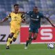 Thabo Nodada of Cape Town City challenges Tshepang Moremi of AmaZulu FC