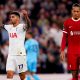 Tottenham Hotspur's Cristian Romero (left) celebrates as Liverpool's Virgil van Dijk appears dejected