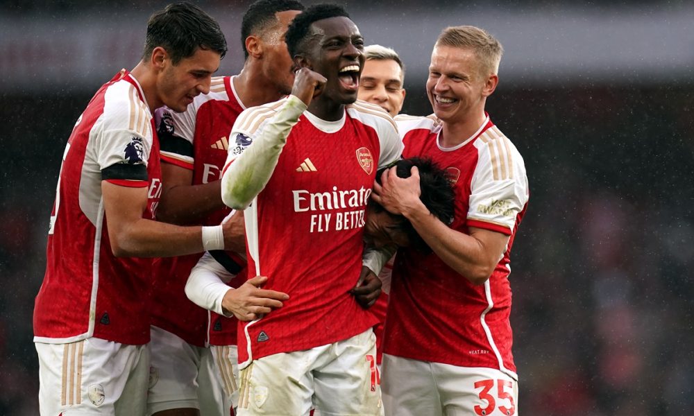 Arsenal's Takehiro Tomiyasu celebrates scoring his sides fifth goal with Eddie Nketiah and Oleksandr Zinchenko