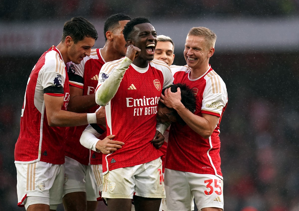 Arsenal's Takehiro Tomiyasu celebrates scoring his sides fifth goal with Eddie Nketiah and Oleksandr Zinchenko