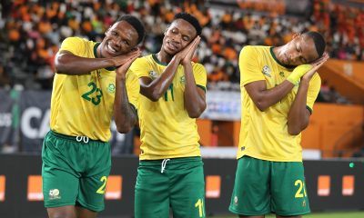 Themba Zwane of South Africa (c) celebrates goal with Lebo Mothiba (l) and Mihlali Mayambela (r)