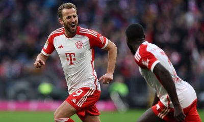 Munich's Harry Kane (L) celebrates with teammate Munich's Dayot Upamecano