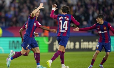 FC Barcelona's striker Robert Lewandowski (L) celebrates with teammate Joao Felix