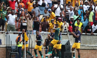 Kaizer Chiefs celebrating scoring a goal.