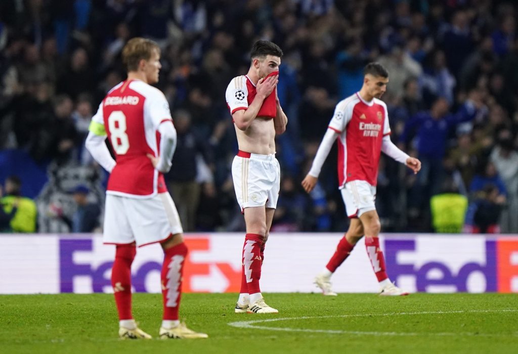 Arsenal's Declan Rice (centre) and team-mates appear dejected after the UEFA Champions League match at Estadio do Dragao in Porto.