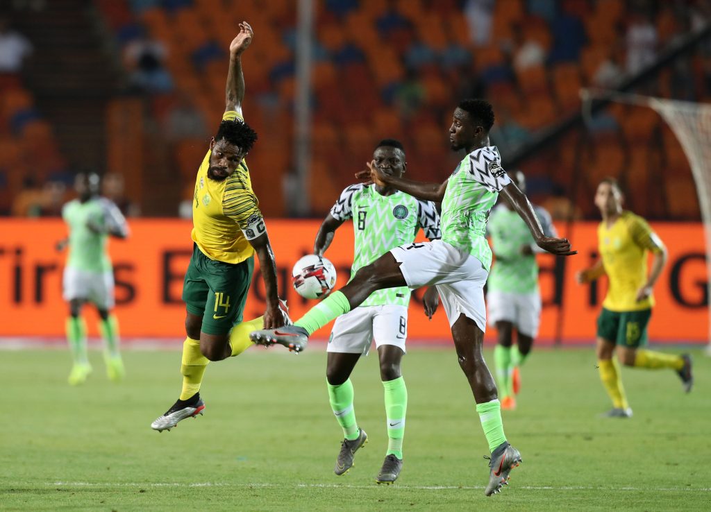 Thulani Hlatshwayo of South Africa challenged by Wilfred Ndidi of Nigeria during the 2019 Africa Cup of Nations Finals, quarterfinals match between Nigeria and South Africa at Cairo International Stadium, Cairo, Egypt on 10 July 2019 ©Samuel Shivambu/BackpagePix
