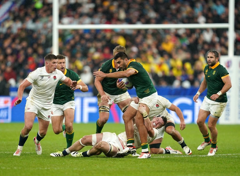 South Africa's Damian de Allende tackled by England's Tom Curry during the Rugby World Cup 2023 semi final match at the Stade de France, Saint-Denis.