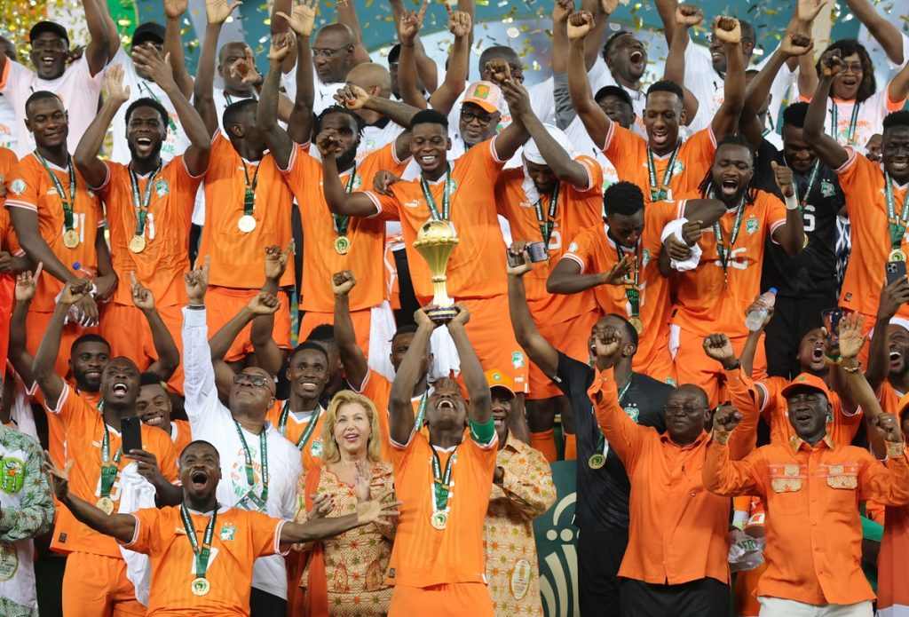 Max Gradel of Ivory Coast lifts the trophy after the 2023 Africa Cup of Nations final between Nigeria and Ivory Coast at the Alassane Ouattara Stadium.
