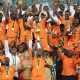 Max Gradel of Ivory Coast lifts the trophy after the 2023 Africa Cup of Nations final between Nigeria and Ivory Coast at the Alassane Ouattara Stadium.