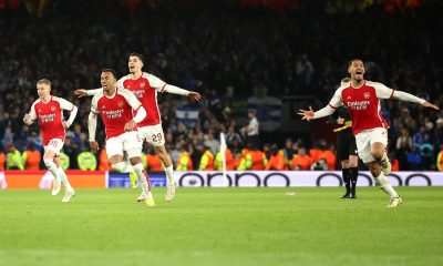 Arsenal players celebrate after the team won the penalty shoot-out of the UEFA Champions League Round of 16 at the Emirates Stadium.