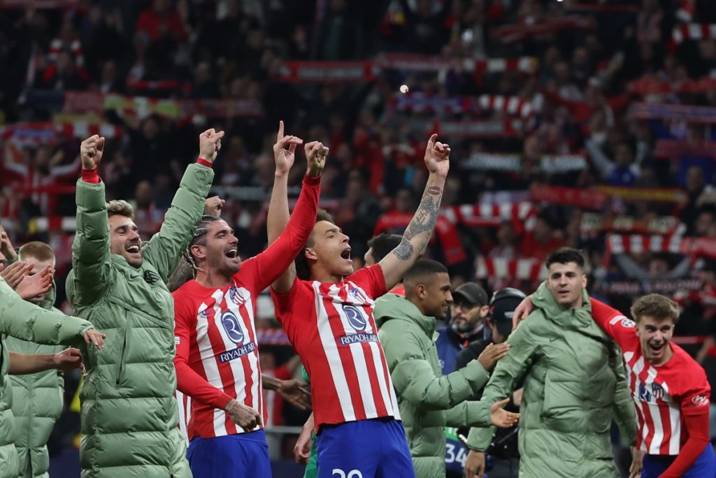 Players of Atletico celebrate their victory following the penalty shootout of the UEFA Champions League round of 16 second leg soccer match between Atletico de Madrid and FC Inter.