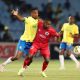 Themba Zwane of Mamelodi Sundowns challenges Siphesihle Ndlovu of Supersport United during the DStv Premiership 2023/24 match between Mamelodi Sundowns and Supersport United at the Loftus Stadium, Pretoria on the 12 March 2024