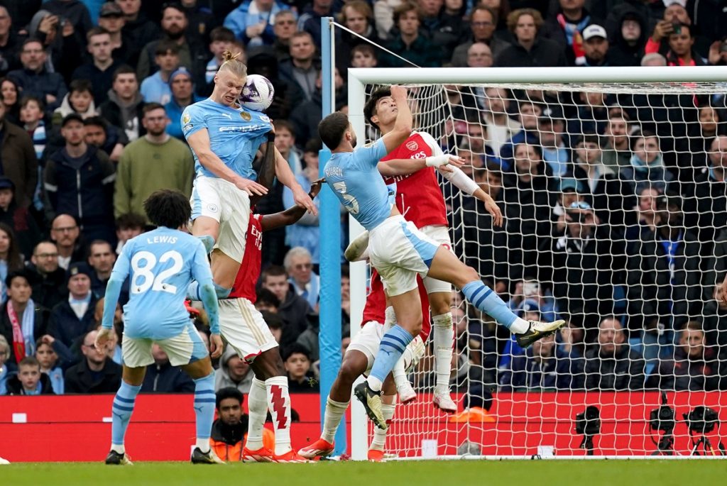 Manchester City's Erling Haaland wins a header during the Premier League match at the Etihad Stadium.