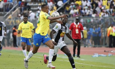 Grant Kekana of Mamelodi Sundowns challenged by Fily Traore of TP Mazembe during the 2023/24 CAF Champions League Group match between Sundowns and TP Mazembe at the Lucas Moripe Stadium