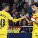 FC Barcelona's Joao Felix (R) celebrates with his teammate Sergio Roberto after scoring the 0-1 goal during the Spanish LaLiga soccer match between Atletico Madrid and FC Barcelona in Madrid
