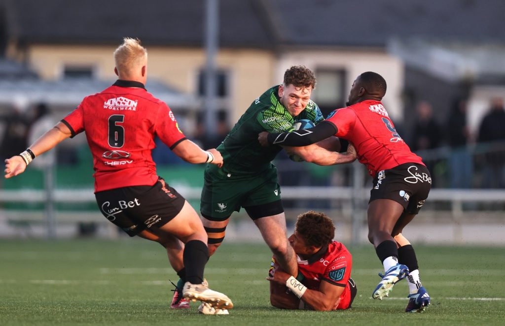 Cathal Forde is tackled by Jordan Hendrikse and Sanele Nohamba of Emirates Lions BKT United Rugby Championship, Dexcom Stadium.