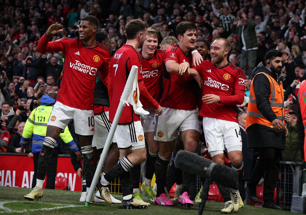 Manchester United players celebrate the 4-3 goal during the FA Cup quarter-final soccer match between Manchester United and Liverpool in Manchester.
